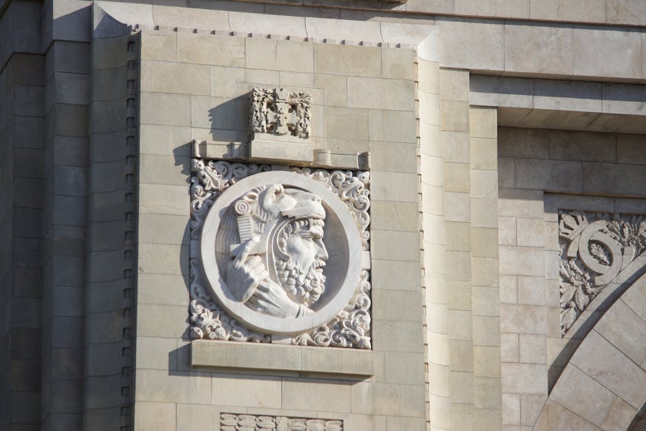 Close-up of a detailed stone relief on an ancient architectural monument.